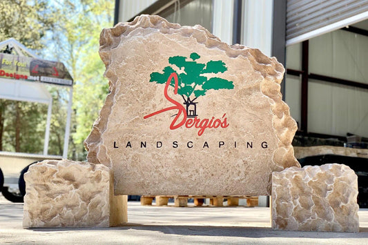 Custom engraved business rock sign at a commercial entrance in the Triangle